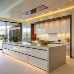 Modern luxury kitchen in Salt Lake City, part of a custom home extension with a central island and warm lighting.